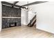 Open floor plan living space with a stone fireplace and staircase at 660 Sun Valley Ct, Indianapolis, IN 46217