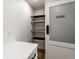 Well-organized pantry with modern countertops and wooden shelves offers ample storage space at 660 Sun Valley Ct, Indianapolis, IN 46217
