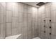 Modern shower featuring elegant tile and a rainfall shower head, offering a spa-like experience at 660 Sun Valley Ct, Indianapolis, IN 46217