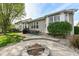 The backyard features a fire pit, patio with outdoor dining, and lush landscaping at 6625 W Winding Bnd, McCordsville, IN 46055