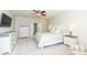 Bright Primary bedroom with white furniture set, a ceiling fan, and carpeted floors at 6625 W Winding Bnd, McCordsville, IN 46055