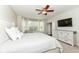 Inviting bedroom with a ceiling fan, bay windows, and white furnishings at 6625 W Winding Bnd, McCordsville, IN 46055