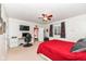 Bright bedroom featuring a ceiling fan, a window with curtains, and a computer setup at 6625 W Winding Bnd, McCordsville, IN 46055