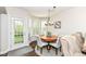 Cozy breakfast nook with a bay window and door leading to the outside at 6625 W Winding Bnd, McCordsville, IN 46055