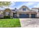 Charming brick home with a three car garage and well-maintained landscaping at 6625 W Winding Bnd, McCordsville, IN 46055
