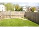 A well-maintained, fenced backyard offers privacy and space for outdoor activities at 6725 Tramcus Dr, Indianapolis, IN 46260