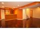 Finished basement area with hardwood flooring, recessed lighting, and a bar area for entertaining at 6725 Tramcus Dr, Indianapolis, IN 46260