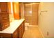 Bathroom featuring tile flooring, a walk-in shower, and wooden vanity at 6725 Tramcus Dr, Indianapolis, IN 46260