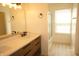 Bright bathroom features a double vanity with modern fixtures and a walk-in shower at 6725 Tramcus Dr, Indianapolis, IN 46260