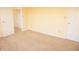 Bedroom with neutral carpet and walls, with a closet visible in the background at 6725 Tramcus Dr, Indianapolis, IN 46260