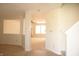 Open-concept entryway boasts neutral paint, and transitions to the living room, creating a light-filled space at 6725 Tramcus Dr, Indianapolis, IN 46260