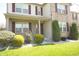 An attractive two-story home features well-maintained landscaping, brick accents and a welcoming front porch at 6725 Tramcus Dr, Indianapolis, IN 46260