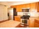 A functional kitchen is equipped with stainless steel appliances, ample cabinet storage, and counter space at 6725 Tramcus Dr, Indianapolis, IN 46260