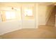 Spacious living room showcasing staircase, open concept, and natural light at 6725 Tramcus Dr, Indianapolis, IN 46260