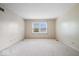 Bright bedroom with neutral walls, carpet flooring, and a large window at 7424 Prairie Lake Dr, Indianapolis, IN 46256