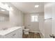 Neutral bathroom featuring modern vanity, toilet, and shower with wood-look flooring at 828 N 13Th St, Elwood, IN 46036