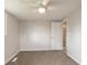 A bright bedroom featuring carpet, a ceiling fan, and a neutral wall color scheme at 828 N 13Th St, Elwood, IN 46036