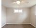 Cozy bedroom with carpet flooring and a ceiling fan at 828 N 13Th St, Elwood, IN 46036