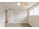 Neutral bedroom featuring carpet, a ceiling fan, and a window for natural light at 828 N 13Th St, Elwood, IN 46036