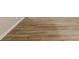 Close-up of flooring with a neutral wood grain pattern at 828 N 13Th St, Elwood, IN 46036