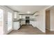 Updated kitchen with white cabinets and stainless steel appliances at 828 N 13Th St, Elwood, IN 46036