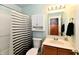 Bathroom features a shower/tub combo, vanity, and neutral paint at 921 Kimberly Ave, Westfield, IN 46074