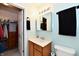 This charming bathroom features a vanity with drawers and cabinet, tile flooring, and a closet at 921 Kimberly Ave, Westfield, IN 46074