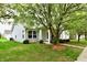 Exterior view of a well-maintained home with a green lawn and mature trees at 921 Kimberly Ave, Westfield, IN 46074