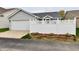 The exterior of this home has light gray siding and a lattice-style white privacy fence at 921 Kimberly Ave, Westfield, IN 46074