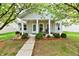 Charming home with a covered front porch, white columns, and well-manicured landscaping at 921 Kimberly Ave, Westfield, IN 46074