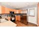 Modern kitchen with stainless steel appliances, light wood cabinetry and stylish backsplash at 921 Kimberly Ave, Westfield, IN 46074