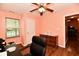 Office features wood-look flooring, a ceiling fan, and natural light from the window at 921 Kimberly Ave, Westfield, IN 46074