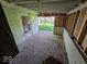 Inside a carport showing cinderblock walls and a view of the yard at 100 N Blue River Dr, Edinburgh, IN 46124