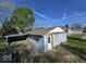 Cozy home exterior featuring a carport and a traditional roof design set against a blue sky at 100 N Blue River Dr, Edinburgh, IN 46124