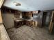 Kitchen view featuring unfinished cabinets, sink and wooden floors at 100 N Blue River Dr, Edinburgh, IN 46124