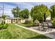 Large backyard featuring a well-maintained lawn, storage shed, and patio dining set for outdoor entertaining at 1044 E Garfield Dr, Indianapolis, IN 46203