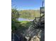 Backyard view from deck with lake and tree line background at 10770 W 650 S, Columbus, IN 47201