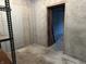 Unfinished basement space featuring concrete walls and floors and a doorway to another room at 10770 W 650 S, Columbus, IN 47201
