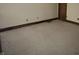 A carpeted room with white walls and minimal décor at 10770 W 650 S, Columbus, IN 47201