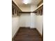 Spacious walk-in closet with a bright light and generous shelving at 10770 W 650 S, Columbus, IN 47201