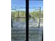 View from the deck showcasing the beautiful surrounding lake and trees at 10770 W 650 S, Columbus, IN 47201