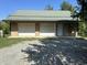 Exterior shot of detached garage with two garage doors and metal roof at 10770 W 650 S, Columbus, IN 47201