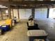 Large garage interior featuring a concrete floor and open ceiling at 10770 W 650 S, Columbus, IN 47201