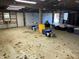 Garage interior showing the open studs and concrete floor at 10770 W 650 S, Columbus, IN 47201