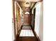 Inviting hallway featuring a wood door, tile accents, and rustic charm at 10770 W 650 S, Columbus, IN 47201