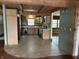 Rustic kitchen with wooden cabinets, tile floors, and ample counter space at 10770 W 650 S, Columbus, IN 47201