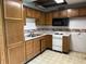 Outdated kitchen with oak cabinets and white appliances at 10770 W 650 S, Columbus, IN 47201