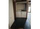 Laundry area featuring a washer and dryer, with an exposed ceiling and unfinished floors at 10770 W 650 S, Columbus, IN 47201