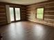 Living room with sliding doors to deck and view of nature outside at 10770 W 650 S, Columbus, IN 47201