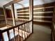 Open loft area featuring wood beams and stylish sconce lighting at 10770 W 650 S, Columbus, IN 47201
